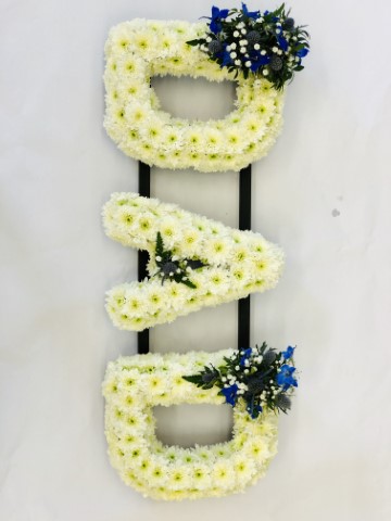 <h2>DAD White Funeral Letters | Funeral Flowers</h2>
<ul>
<li>Approximate Size W 90cm H 30cm</li>
<li>Hand created DAD tribute letter in white</li>
<li>Flower spray can be made in any colour (shown in blue on this picture)</li>
<li>To give you the best we may occasionally need to make substitutes</li>
<li>Funeral Flowers will be delivered at least 2 hours before the funeral</li>
<li>For delivery area coverage see below</li>
</ul>
<h2><br />Liverpool Flower Delivery</h2>
<p>We have a wide selection of Funeral Tributes offered for Liverpool Flower Delivery. Funeral Tributes can be provided for you in Liverpool, Merseyside and we can organize Funeral flower deliveries for you nationwide. Funeral Flowers can be delivered to the Funeral directors or a house address. They can not be delivered to the crematorium or the church.</p>
<br>
<h2>Flower Delivery Coverage</h2>
<p>Our shop delivers funeral flowers to the following Liverpool postcodes L1 L2 L3 L4 L5 L6 L7 L8 L11 L12 L13 L14 L15 L16 L17 L18 L19 L24 L25 L26 L27 L36 L70 If your order is for an area outside of these we can organise delivery for you through our network of florists. We will ask them to make as close as possible to the image but because of the difference in stock and sundry items, it may not be exact.</p>
<br>
<h2>Liverpool Funeral Flowers | Letters</h2>
<p>This DAD tribute letter is made using a mass of white double spray chrysanthemums edged with foliage and featuring a spray of flowers in any colour (shown in Blue here).</p>
<br>
<p>Name Funeral Tributes or Letter Funeral Flowers are a way to create a tribute that is truly unique and specially designed for a loved one.</p>
<br>
<p>These are usually selected by family members to indicated their relation to their loved one. Sometimes groups of friends or groups of workplace colleagues select a word they associate with the deceased.</p>
<br>
<p>Letter or Name Funeral Tributes can be done in a massed style of white flowers with small sprays or as mixed flowers where the letters are all written in a variety of flowers of the same colour palette.</p>
<br>
<p>The flowers are arranged in floral foam, which means the flowers have a water source so they look the very best on the day.</p>
<br>
<p>Contents of tribute: 35 White Spray Chrysanthemums. The Blue spray will contain seasonal blue and white flowers such as roses, lisianthus, spray roses, eryngium and gypsophila - different coloured sprays will have similar types of flowers and mixed seasonal foliage.</p>
<br>
<h2>Best Florist in Liverpool</h2>
<p>Trust Award-winning Liverpool Florist, Booker Flowers and Gifts, to deliver funeral flowers fitting for the occasion delivered in Liverpool, Merseyside and beyond. Our funeral flowers are handcrafted by our team of professional fully qualified who not only lovingly hand make our designs but hand-deliver them, ensuring all our customers are delighted with their flowers. Booker Flowers and Gifts your local Liverpool Flower shop.</p>
<p><br /><br /><br /></p>
<p><em>Debra G - Review from Yell - Funeral Flowers Liverpool</em></p>
<br>
<p><em>This 5 Star review was from Yell.com - Booker Flowers and Gifts - Reviews</em></p>
<br>
<p><em>Fleur and her team made the flowers for my Dad's funeral. I knew I wanted something quite specific but was quite unsure how to execute the idea. Fleur understood immediately what I was hoping to achieve and developed the ideas into amazingly beautiful flowers that were just perfect. I honestly can't recommend her highly enough - she created something outstanding and unique for my Dad. Thanks Fleur </em></p>
<br>